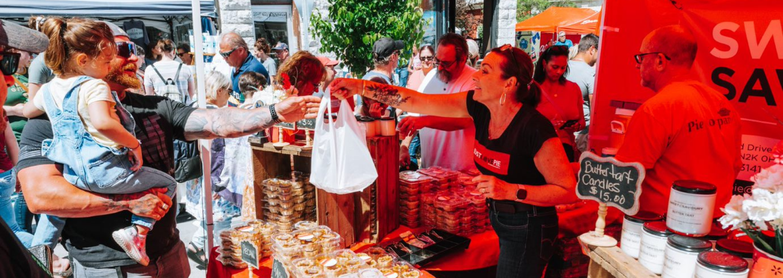 Lady handing bag to customer