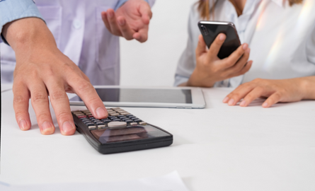 Two people with calculator