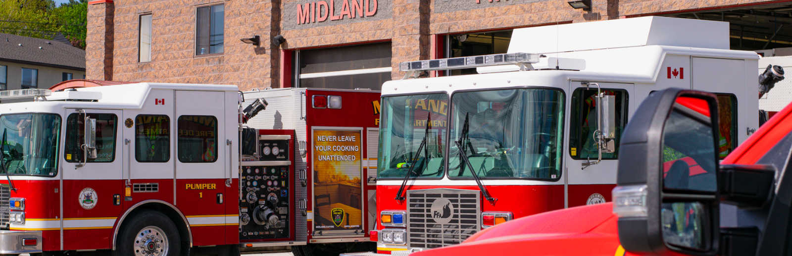 Photo of Midland Fire Department with trucks in garages.