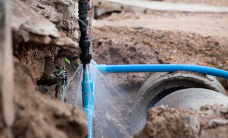 Pipes connecting with water spewing out