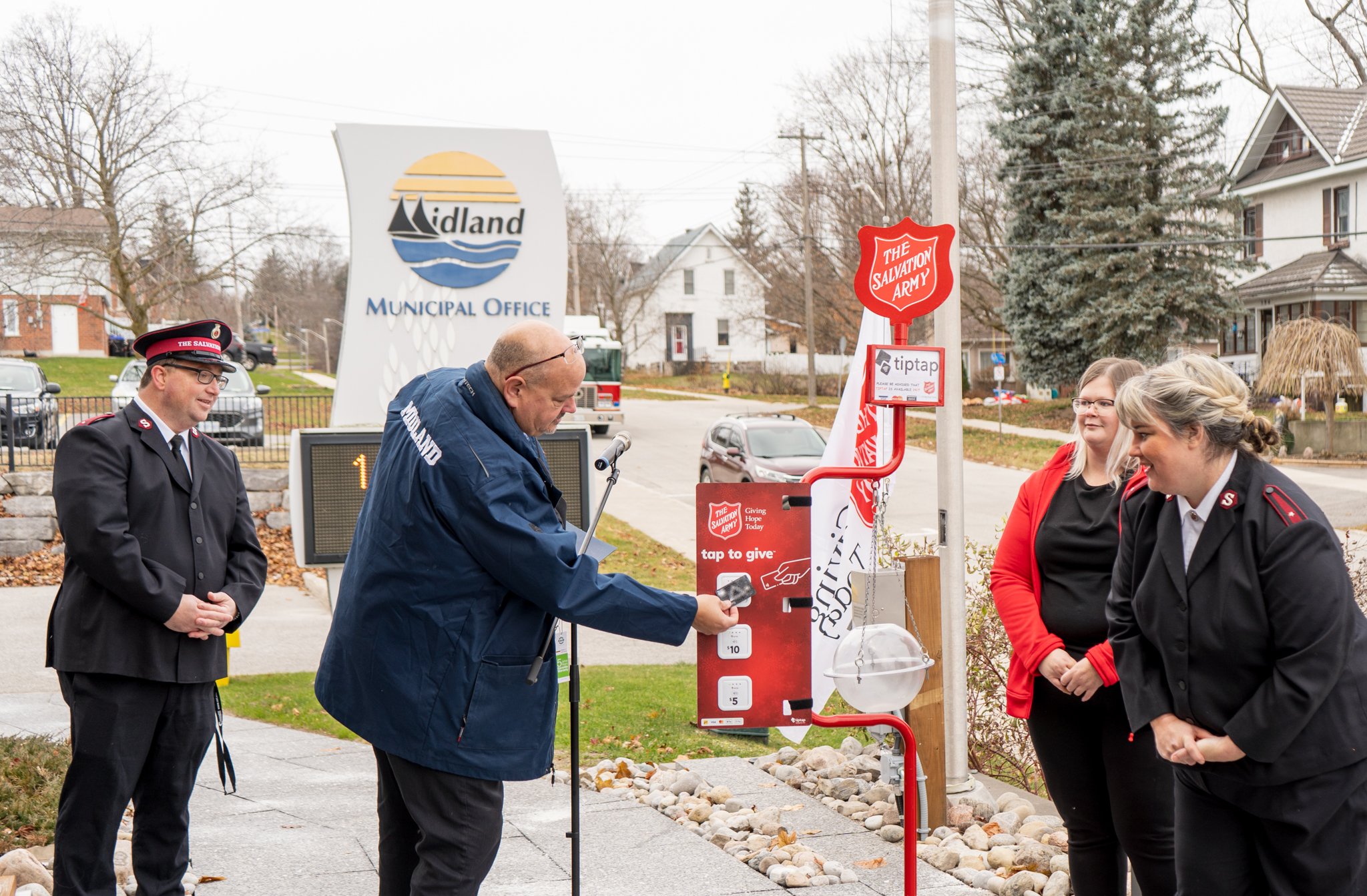 People standing with a Salvation Army Kettle 