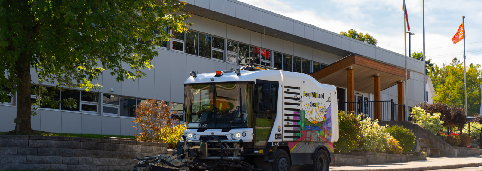 street sweeper driving on road