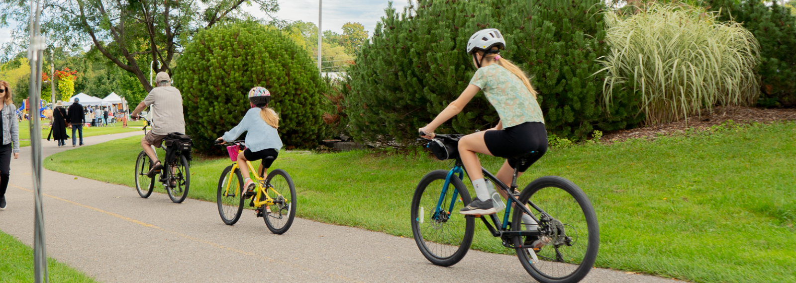 people biking on pathway