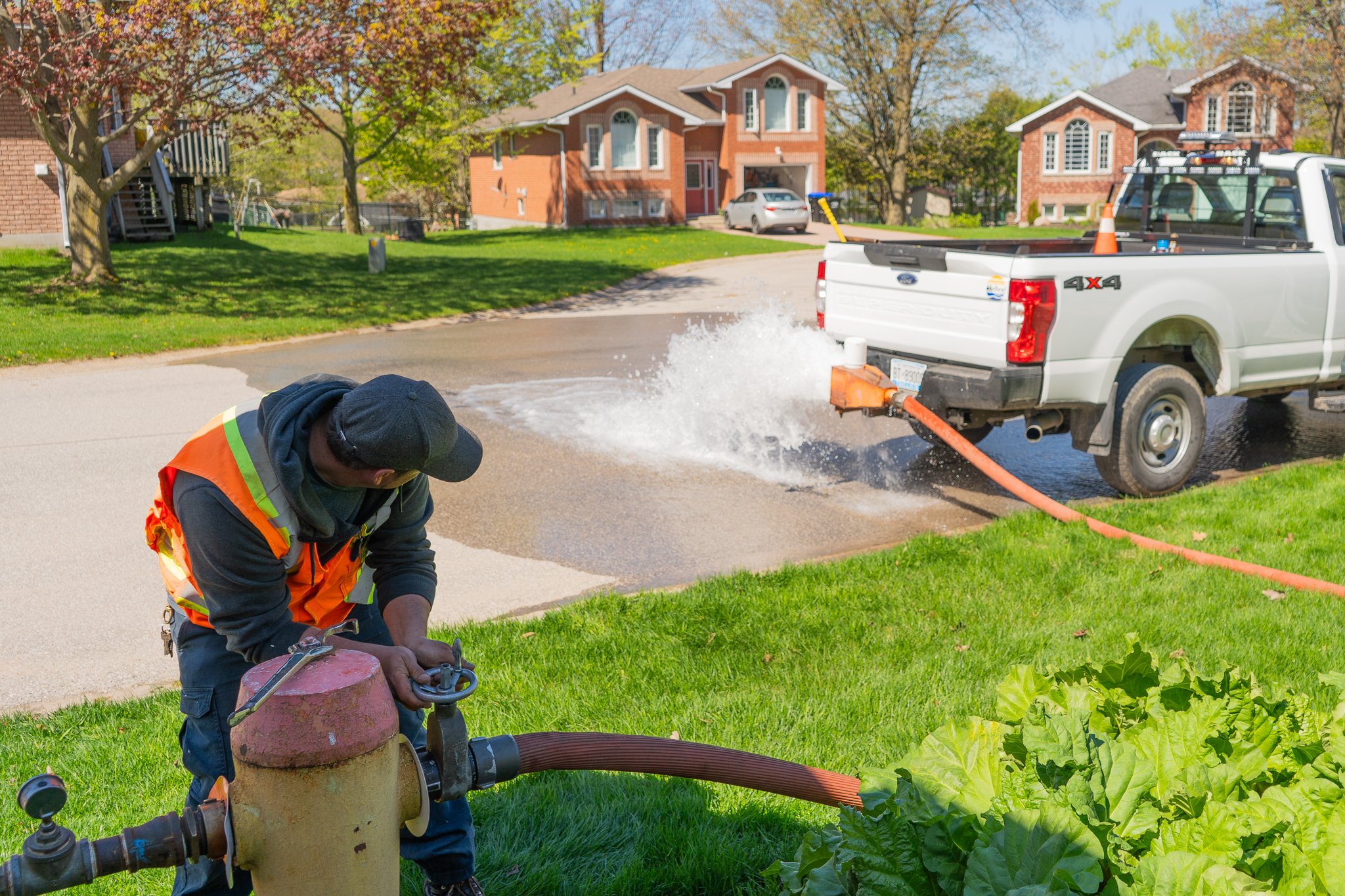 person by fire hydrant for unidirectional flushing