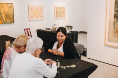 people participating in beading workshop