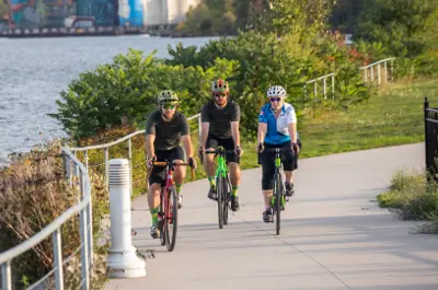 people cycling on waterfront trail