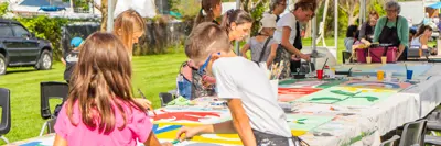 Children painting at Midland Mural Festival